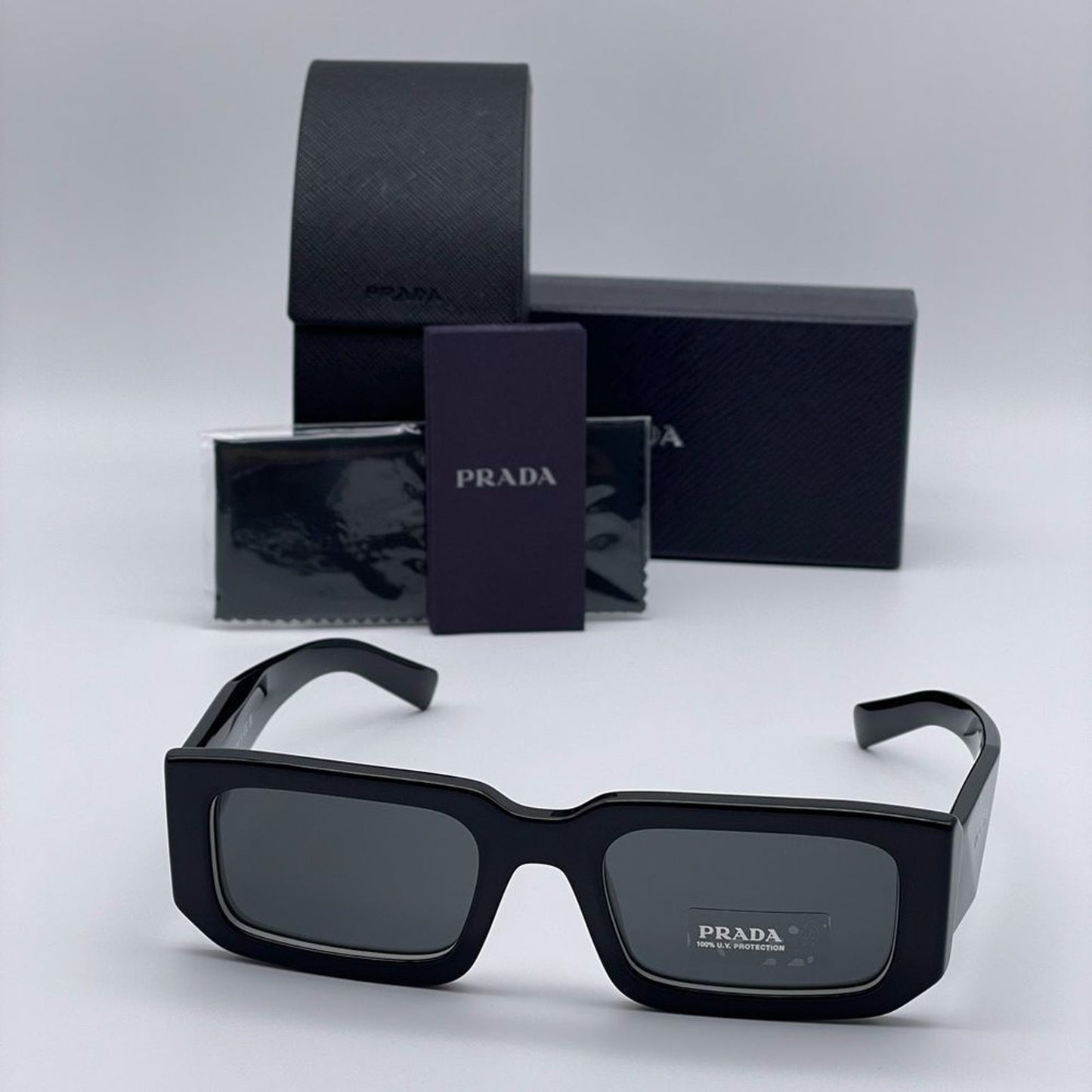 Prada Sunglasses PR06YSF 09Q5S0 Black White/Dark Grey Unisex